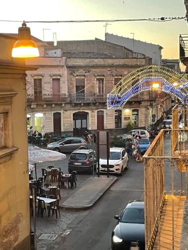 a city street with cars parked on the street at Dimora Barocca in Militello in Val di Catania