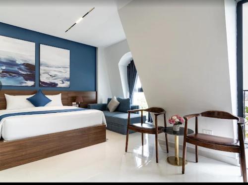 Postel nebo postele na pokoji v ubytování KAPÁS Hotel - House & Drinks Đồi Rồng
