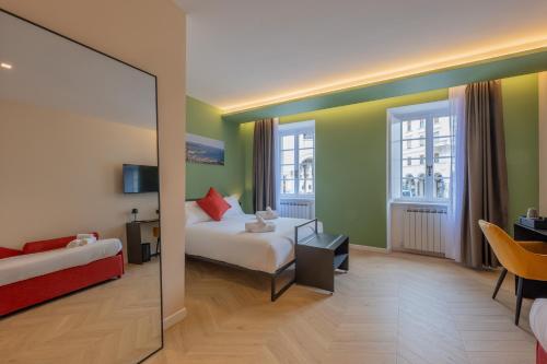 a hotel room with a bed and a mirror at Luna Stay in Trieste
