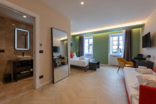 a hotel room with a bed and a mirror at Luna Stay in Trieste
