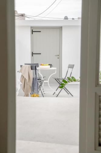 a living room with a table and chairs at Yposkafon Concept Two-Bedroom Villa with Private Jacuzzi and Hamam in Megalokhori