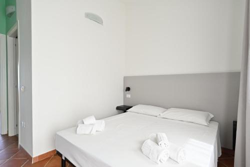 Postel nebo postele na pokoji v ubytování Residence Rocce Rosse