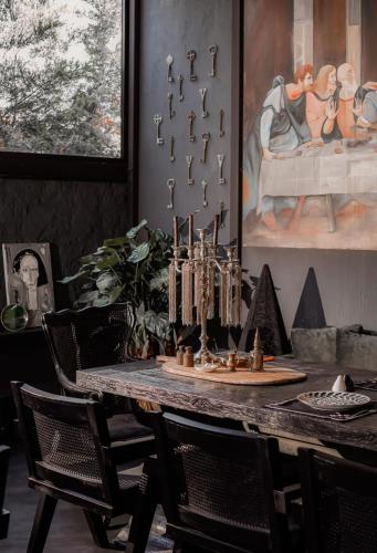 a dining room with a table with a chessboard on it at The Local House Alaçatı in Alacati