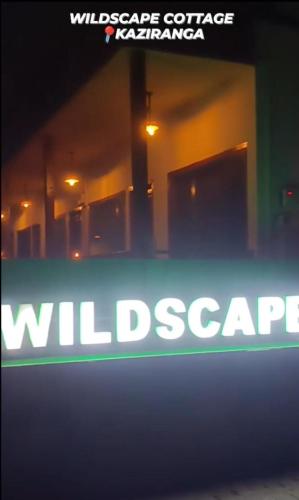 a close up of a sign that reads wildlifeescape at Wildscape kaziranga in Kāziranga