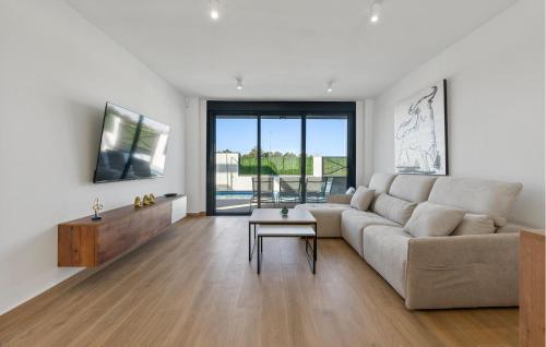 a living room with a couch and a table at Amazing Home In San Javier in San Javier