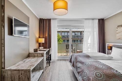 Ένα ή περισσότερα κρεβάτια σε δωμάτιο στο Hotel Strand No.1