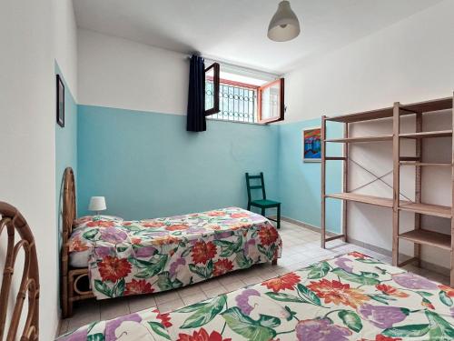Ένα ή περισσότερα κρεβάτια σε δωμάτιο στο Casa duna sulla spiaggia