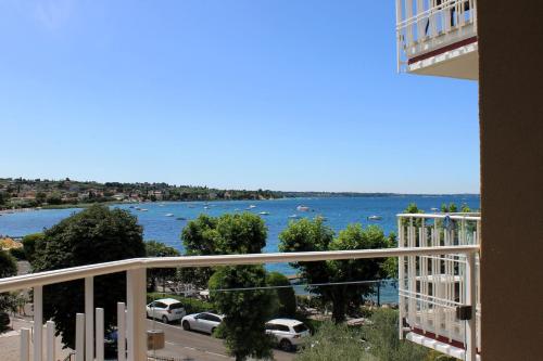 a view of the water from a balcony of a building at Kriss Internazionale Hotel in Bardolino