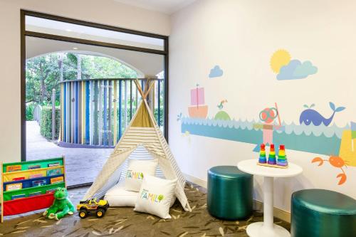 a childs room with a play area with a toy pyramid at The Westin Reserva Conchal, an All-Inclusive Golf Resort & Spa in Playa Conchal