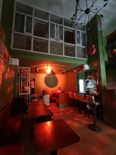 a room with tables and chairs in a restaurant at Viet Vintage Hostel n Pub - Soft mattress - Free Breakfast in Hanoi