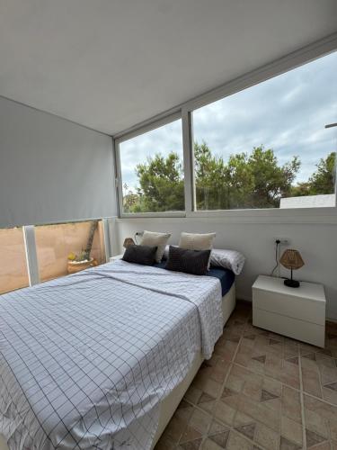 Postel nebo postele na pokoji v ubytování Villa Campello Beach