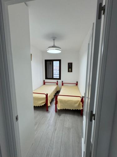 Ένα ή περισσότερα κρεβάτια σε δωμάτιο στο Apartamento Completo en Chipiona