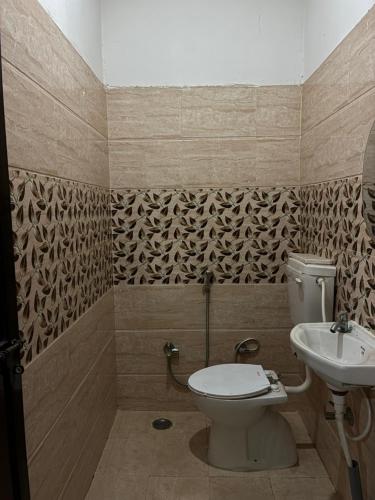 Ένα μπάνιο στο Shree Radha Madhav Accommodation