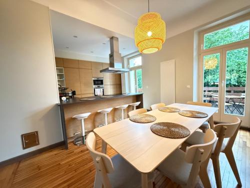 a kitchen and dining room with a table and chairs at Le Gaston de Belair - Room 005 - 2nd floor - shared Kitchen in Ferme Thibesart