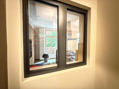 a window in a room with a view at Le Gaston de Belair - Room 005 - 2nd floor - shared Kitchen in Ferme Thibesart