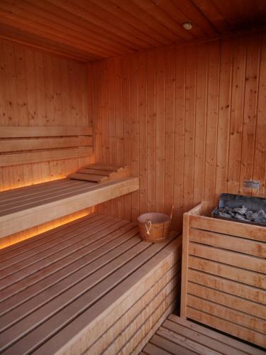 a wooden sauna with two beds in it at Hotel Paradiso Como in Brunate