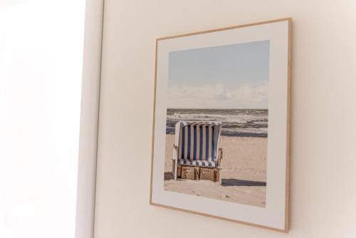a picture of a chair on the beach at Il tuo rifugio vista mare DIMORA SABUCCHI in Pescara