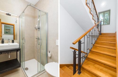 a bathroom with a shower and a sink and a staircase at Villa Philia by Villsy in Butkovići