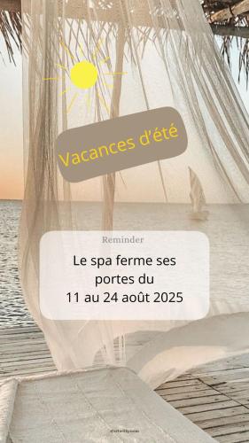 a sign in front of a beach with a tent at Les terres de Marie - Logements calmes et modernes in La Haye-en-Lyons
