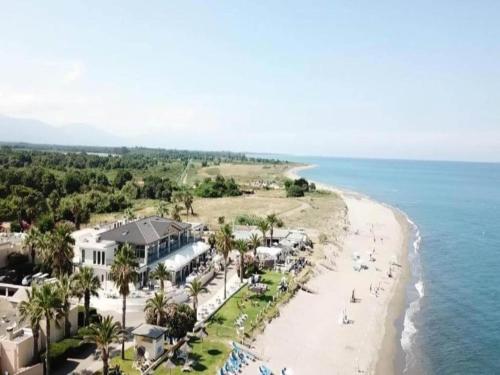 an aerial view of a beach and the ocean at Riverside Home in Folelli in Penta-di-Casinca