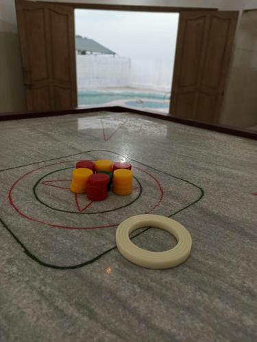 a toy train on the floor in front of a mirror at Karachi Farm House in Karachi