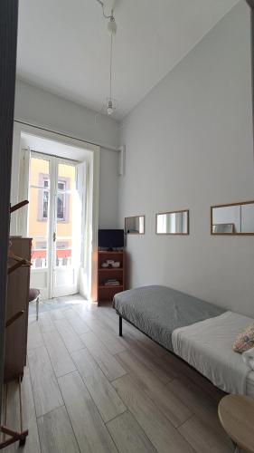 a bedroom with a bed and a dresser and a window at Cupola San Marcellino in Naples