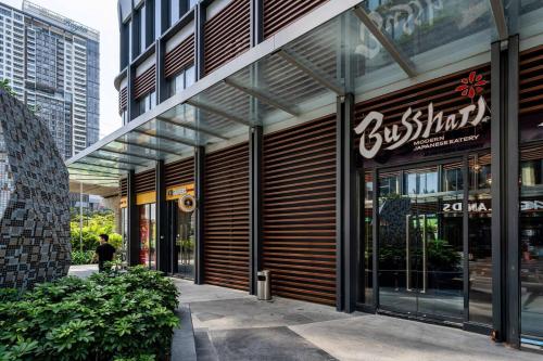 a store front of a building with glass doors at Lumiere Riverside Heera Stay Apartment in Ho Chi Minh City