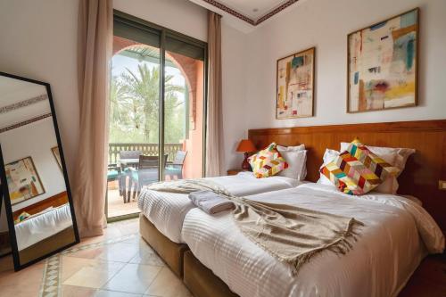 Voodi või voodid majutusasutuse Palmeraie vintage apartment with pool toas