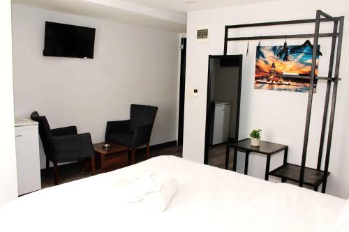 Ένα ή περισσότερα κρεβάτια σε δωμάτιο στο biglife hotel