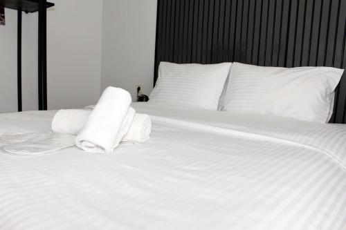 Ένα ή περισσότερα κρεβάτια σε δωμάτιο στο biglife hotel