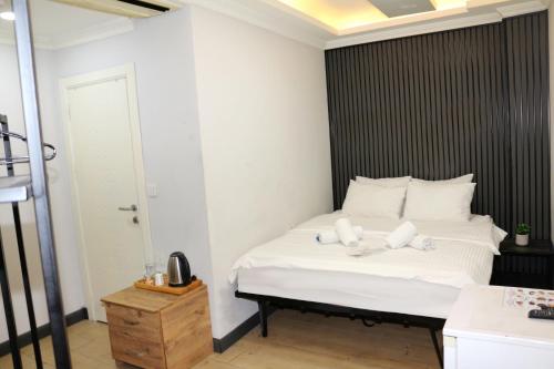 Ένα ή περισσότερα κρεβάτια σε δωμάτιο στο biglife hotel