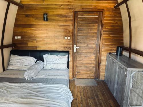 Кровать или кровати в номере Beranda Villa