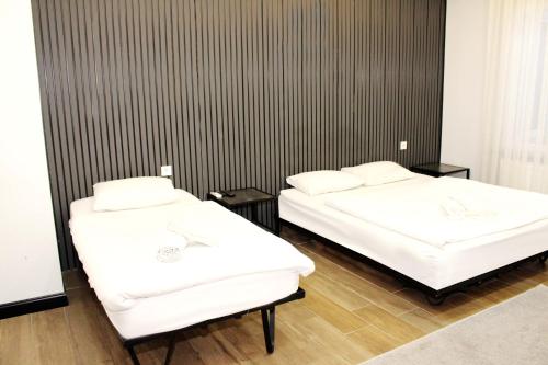 Ένα ή περισσότερα κρεβάτια σε δωμάτιο στο biglife hotel