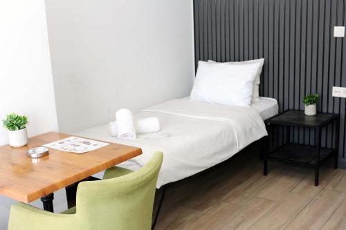 Ένα ή περισσότερα κρεβάτια σε δωμάτιο στο biglife hotel