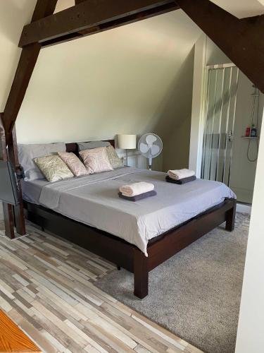 a bedroom with a bed with two towels on it at Cozy Private Room 707 on a Busy Persian Restaurant in Eindhoven