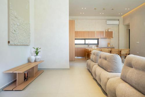 a living room with a couch and a table at Elithos Villa in Vryses