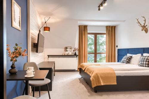 Postel nebo postele na pokoji v ubytování Aspen House Zakopane & spa