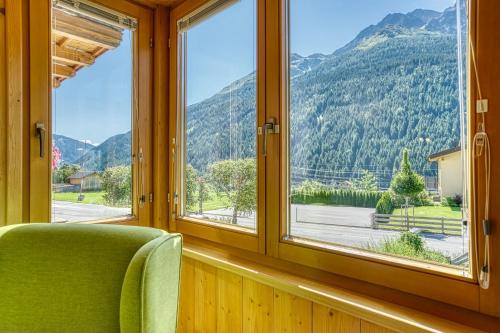 a room with a window with a view of a mountain at Haus St. Bernard in Pettneu am Arlberg