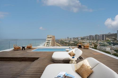 a view from the roof of a building with a pool at Leonardo Plaza Haifa in Haifa