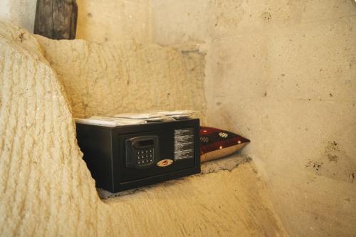 a microwave sitting in a corner of a wall at Vie Cappadocia - Adults Only in Nevsehir