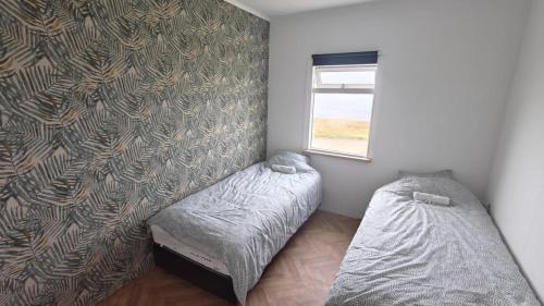 Ένα ή περισσότερα κρεβάτια σε δωμάτιο στο House at the Arctic Circle - Grímsey