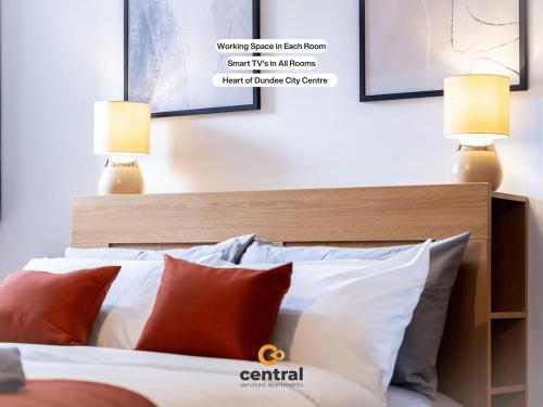 a bedroom with a bed with red and white pillows at CENTRAL SERVICED APARTMENTS - Heart of City Centre - 2 x Double Bedrooms - Working Desk Spaces - Smart TVs in All Rooms - Close to Transport Routes - Fully Equipped in Dundee