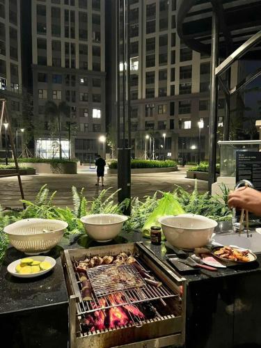 a grill with three bowls of food on a table at Green Zone - San Tower Dragon Castle in Ha Long