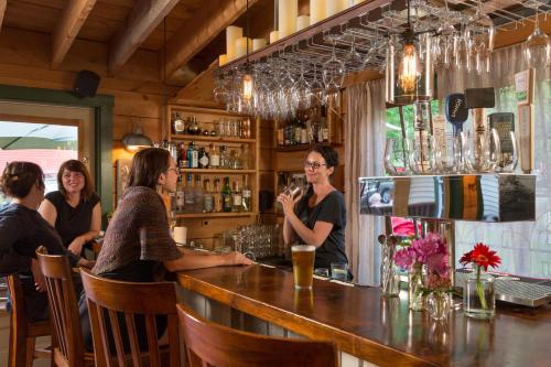 a group of people sitting at a bar at Squam Lake Inn in Holderness