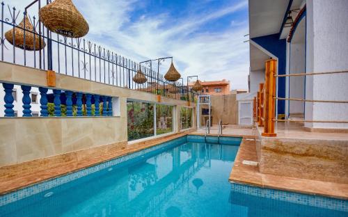 a swimming pool in a house at BLUE WAVE LODGE in Imi Ouaddar