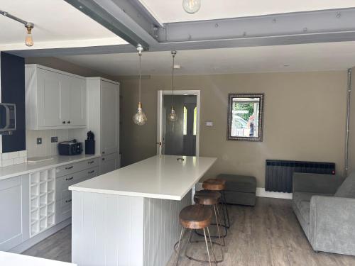 a kitchen with a white island in a room at Williamson House Lancaster in Lancaster