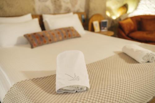 a hotel room with two towels on a bed at Vie Cappadocia - Adults Only in Nevsehir