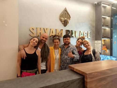 a group of people posing for a picture at a salon at HOTEL SHYAM PALACE INDIA AGRA in Agra
