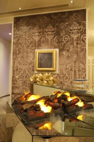 a room with a table with some food on it at Hotel Villa Pascucci in Durrës