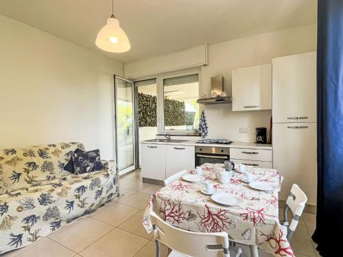 a living room with a table and a kitchen at Holiday Home Villa Jose - PGI212 by Interhome in Civezza